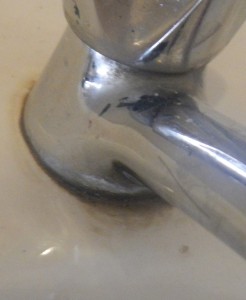 old soap residue around the bathroom tap/faucet 