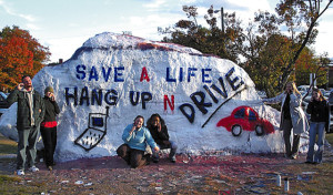 Safe cell phone use advocates, from left, Troy Creason, Annette Skoczylas (CQ), Kristin Kelly, Jocelyn Wilson, Dana Moody and Lisa Fuller display their message on the Rock on Oct. 28, 2008 at the University of Tennessee. Members of the group want get the message out about the dangers of talking while driving as part of a public health class they are taking.